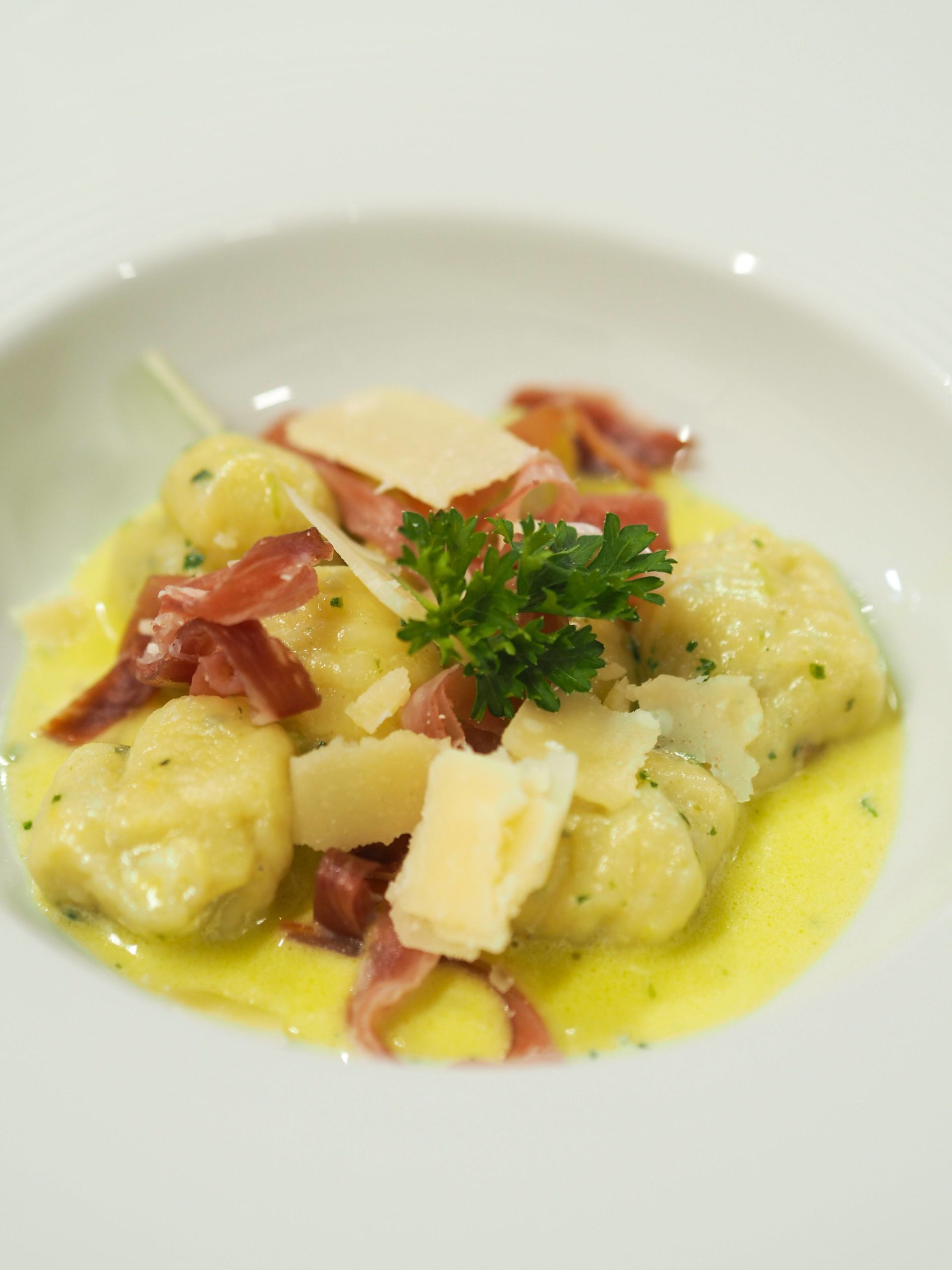 Bordier Wild Garlic and Kampot Pepper Butter Gnocchi with Black Forest Prosciutto and Grana Padano Shavings